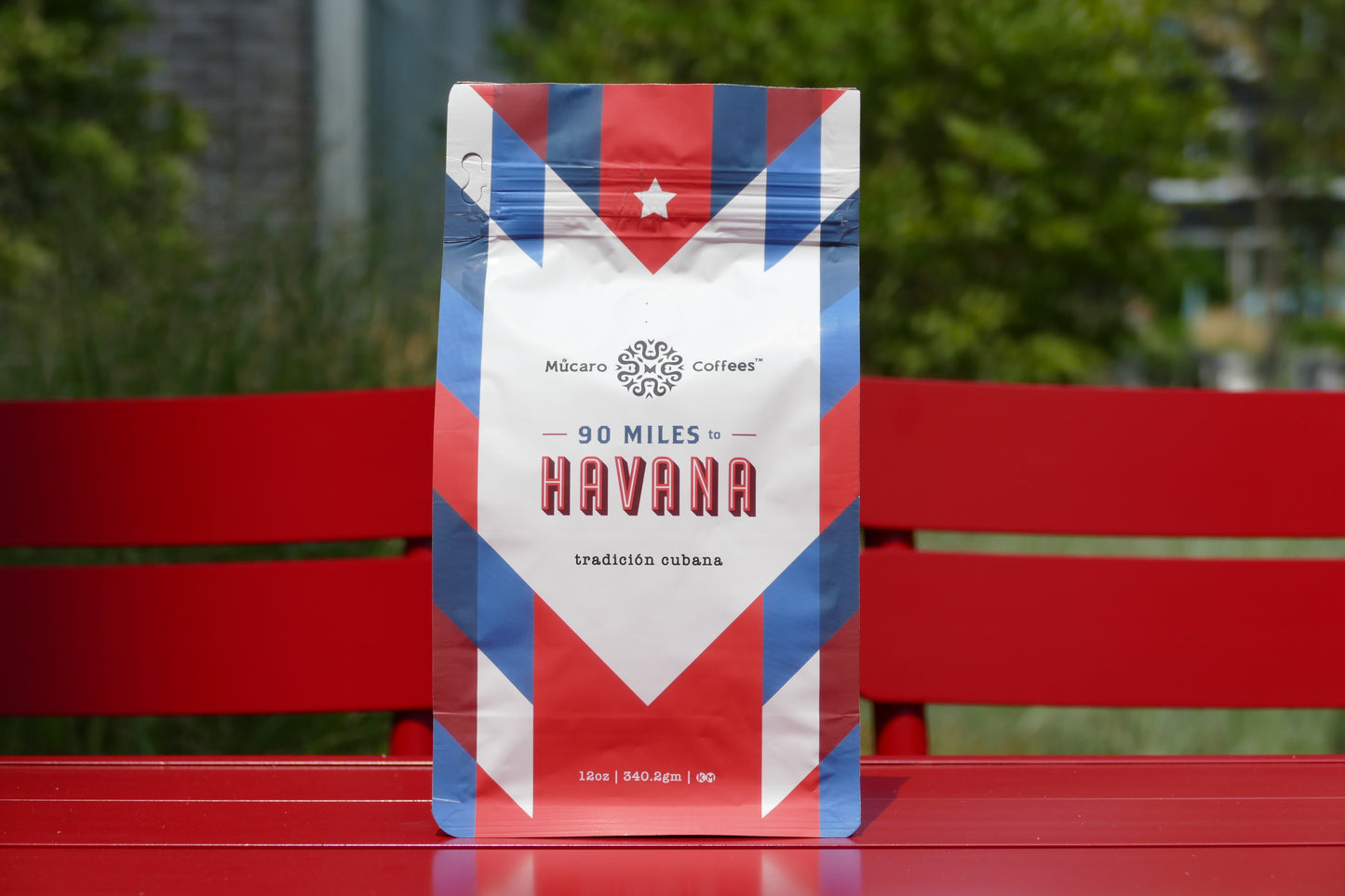 mucaro coffees 90 miles to havana bag on a red bench for display