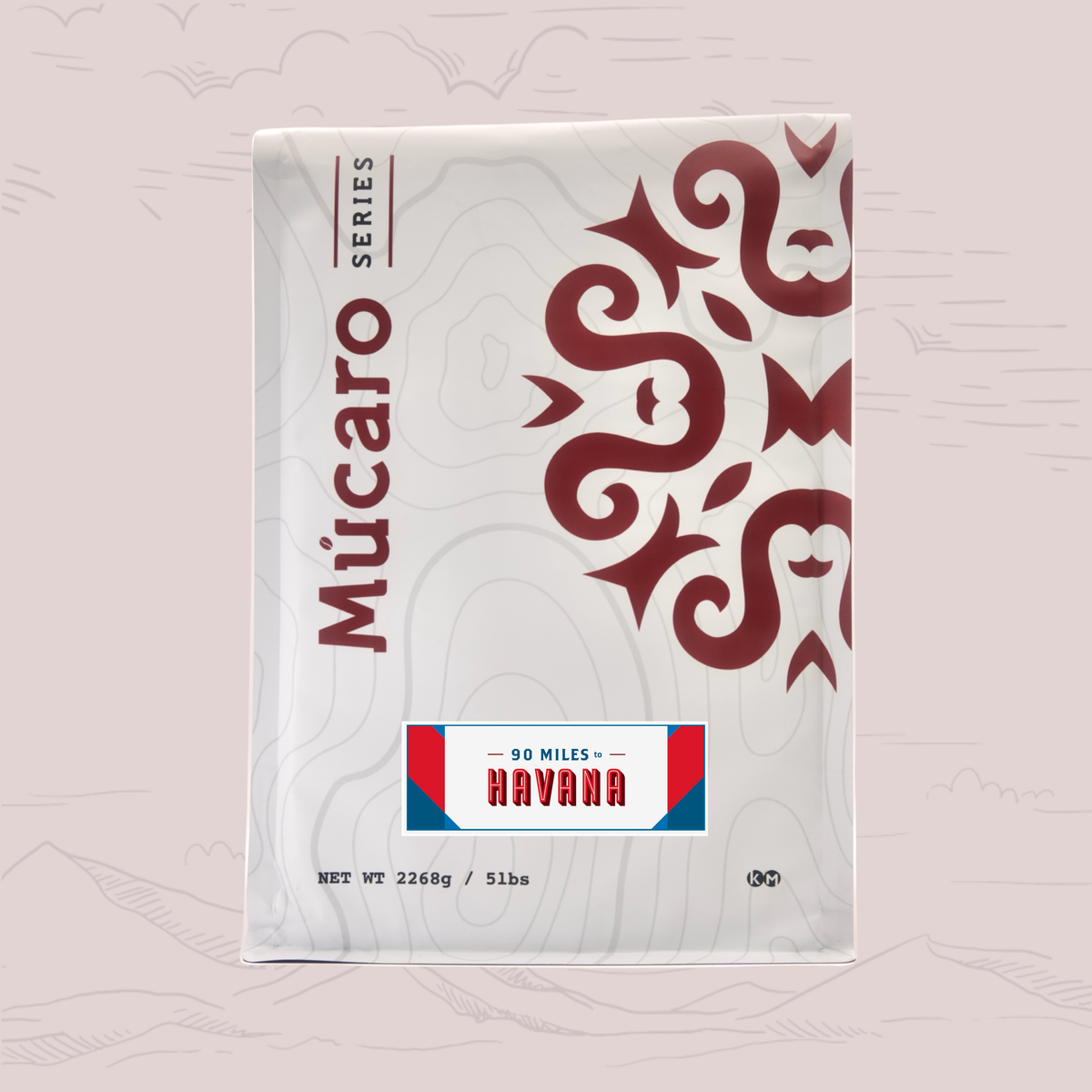 A package of Mucaro Series 90 Miles to Havana blend, featuring a white bag with a dark red ornamental pattern and a red, white, and blue label, set against a light pink background with faint mountain illustrations.