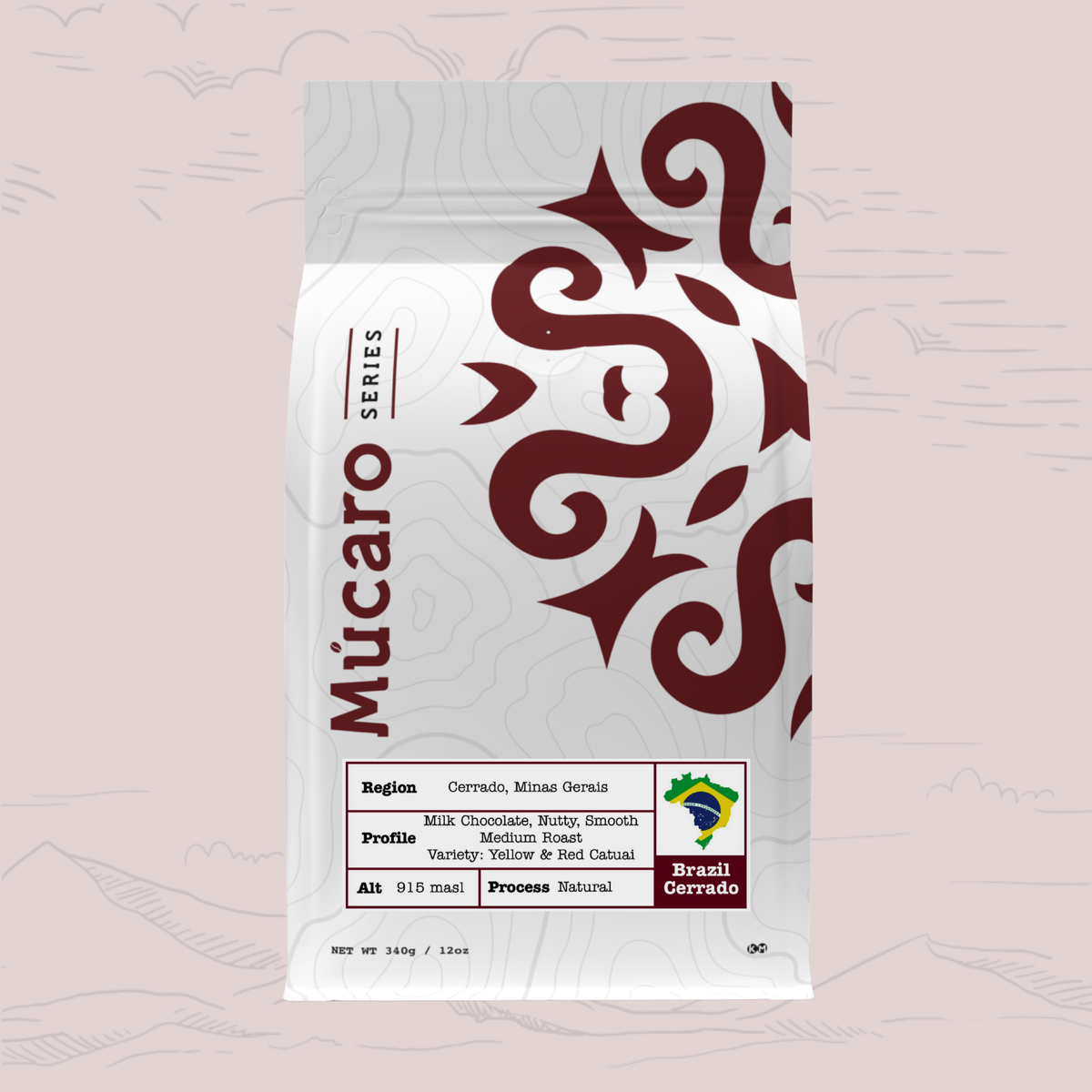 A stand-up pouch of Mucaro Series coffee from Cerrado Mieniro, Brazil featuring a white background with dark red decorative swirls and text, set against a light pink background with faint mountain line drawings.