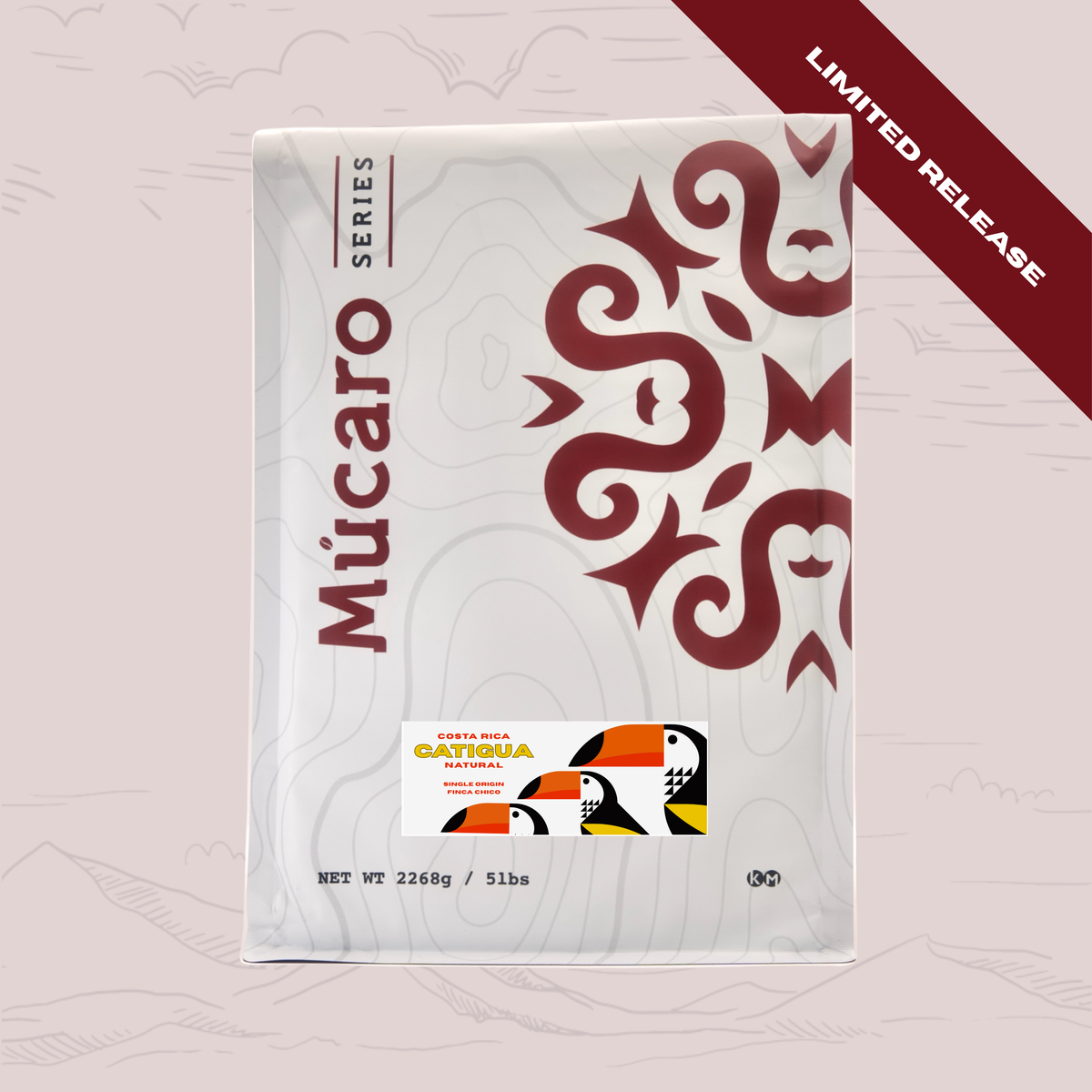 A package of Mucaro Series Catigua Natural coffee from Costa Rica, featuring a white bag with a dark red stylized graphic and a small colorful logo. A dark red diagonal banner in the top right corner reads 'LIMITED RELEASE'.
