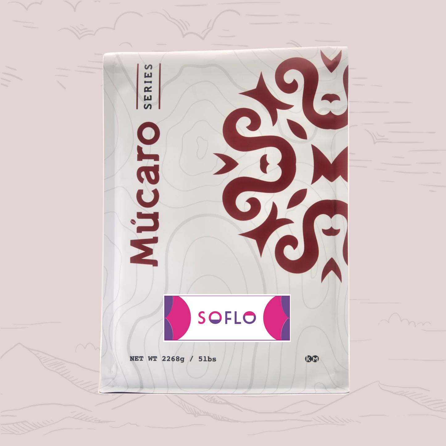 A package of Mucaro Coffees Soflo Blend, featuring a white package with a dark red stylized mask design and a pink and purple Soflo logo label in the center, set against a light pink background with faint mountain line drawings.